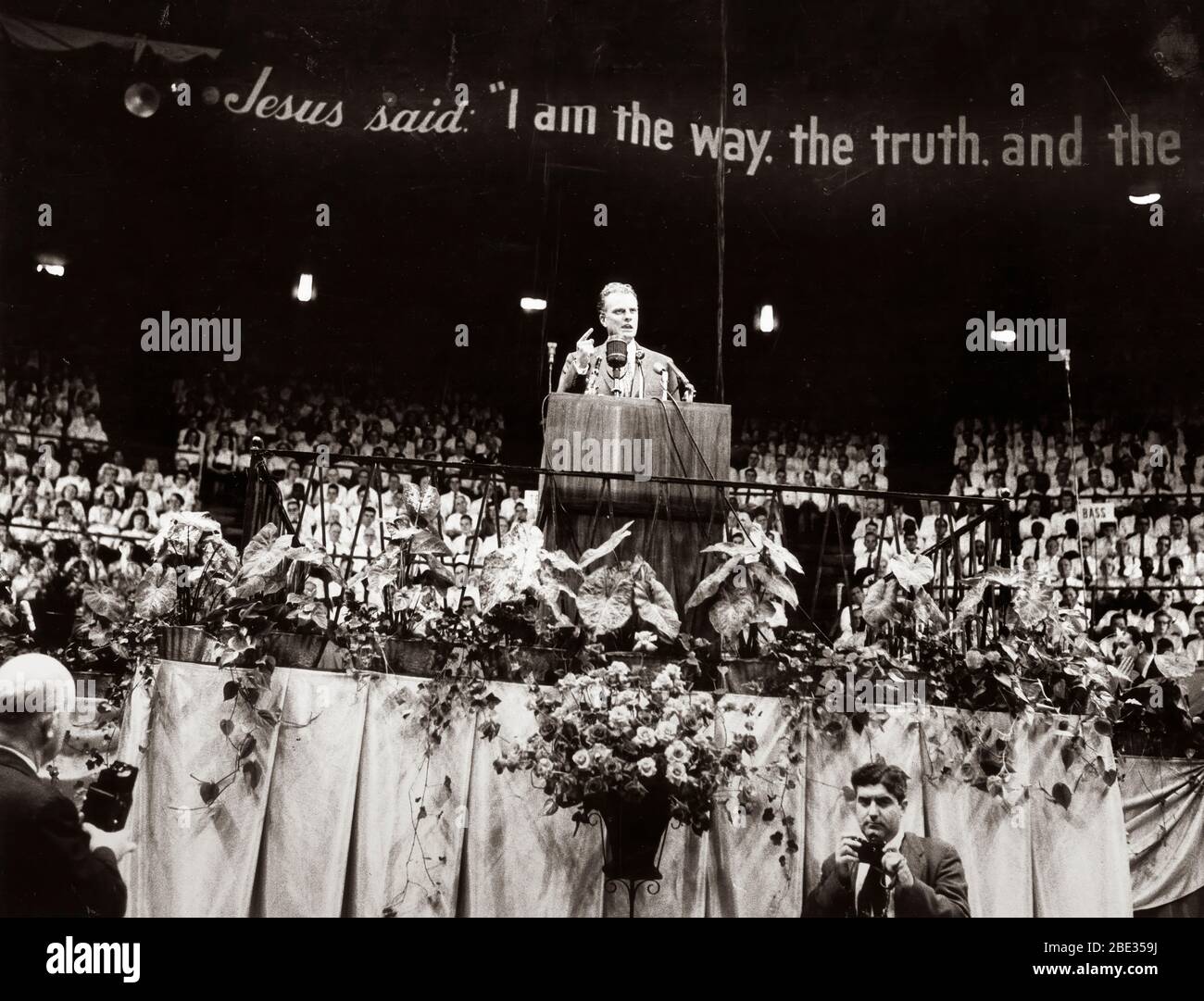 Oct. 2, 1960 - London, England, U.K. - BILLY GRAHAM, born William Franklin Graham, Jr., is an evangelical Christian reverend and evangelist. He gained fame due to his sermons being broadcast on the radio and television. PICTURED: Billy Graham preaching during one of his sermons. Stock Photo