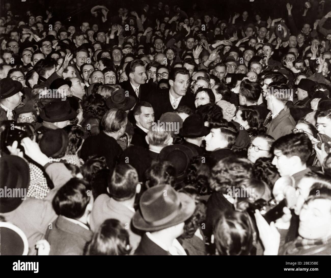 Oct. 2, 1960 - London, England, U.K. - BILLY GRAHAM, born William Franklin Graham, Jr., is an evangelical Christian reverend and evangelist. He gained fame due to his sermons being broadcast on the radio and television. PICTURED: Billy Graham being surrounded by fans. Stock Photo
