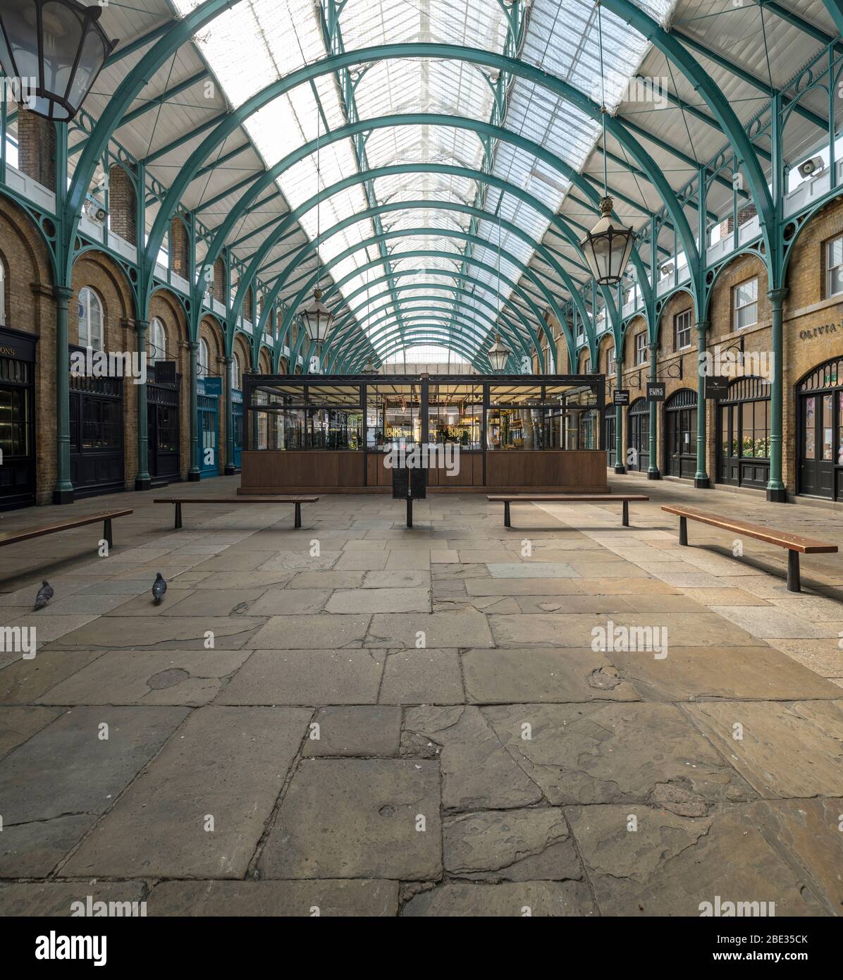 Covent Garden undercover Market deserted, empty and quiet during enforced lockdown throughout London & UK due to coronavirus covid 19 flu pandemic. Stock Photo