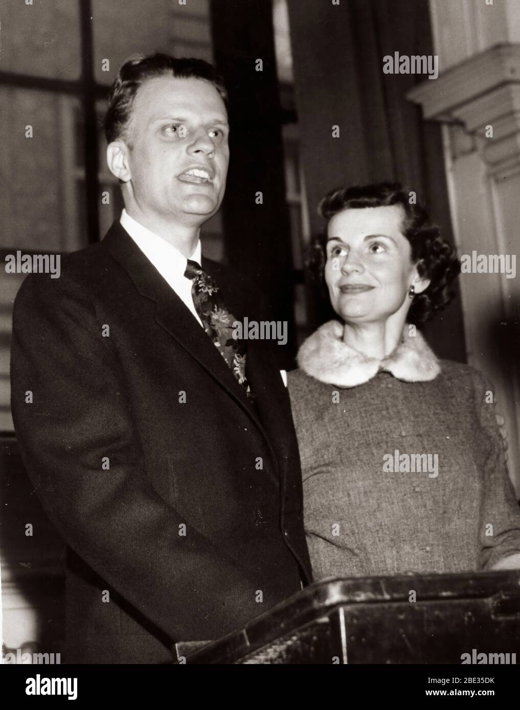 Oct. 2, 1960 - London, England, U.K. - BILLY GRAHAM, born William Franklin Graham, Jr. on November 7, 1918, is an evangelical Christian reverend.  He gained celebrity status by broadcasting his sermons on radio and television. PICTURED: Reverend Billy Graham with wife RUTH GRAHAM. Stock Photo