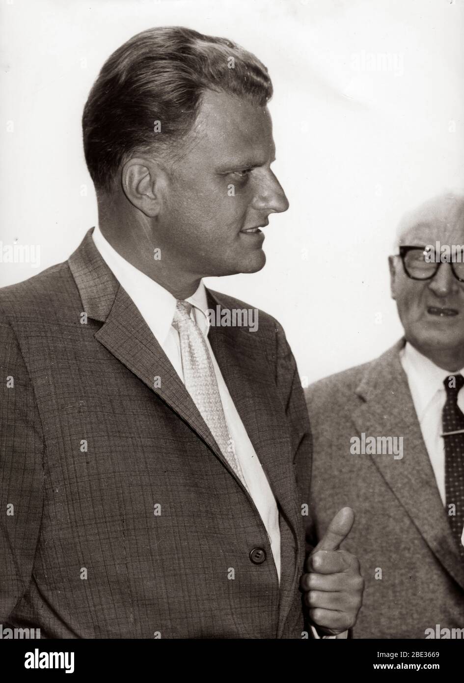 Sep. 18, 1960 - Hamburg, Germany - Evangelical Christian Reverend BILLY GRAHAM chatting with civilians outside his hotel in Hamburg. Stock Photo