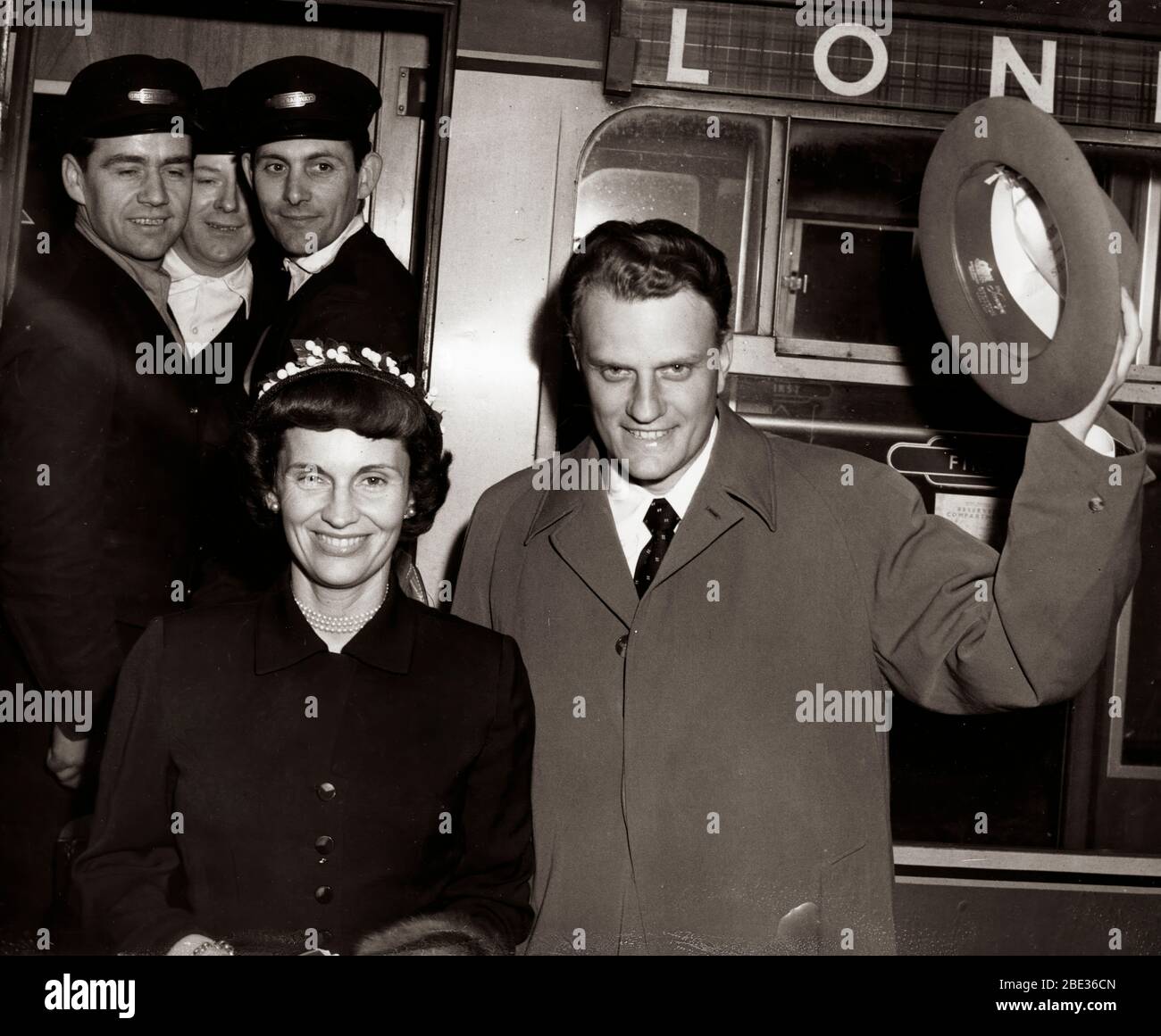 May 11, 1955 - London, England, U.K. - Reverend BILLY GRAHAM arrives at Euston Railway Station from Scotland with his wife RUTH for his crusade which will be taking place at Wembley Stadium. Stock Photo