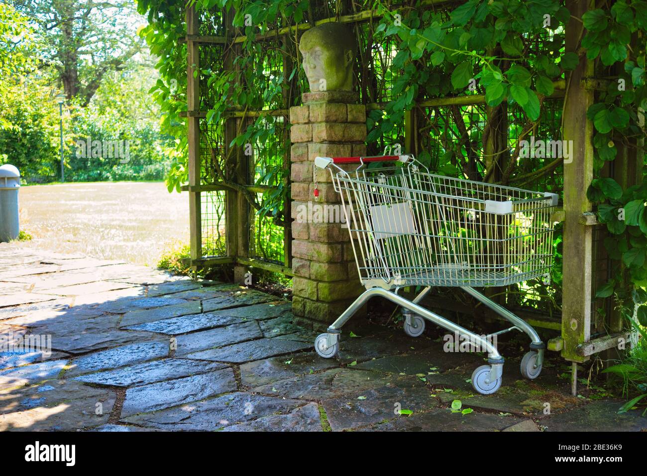 abandoned shopping cart in a park Stock Photo Alamy
