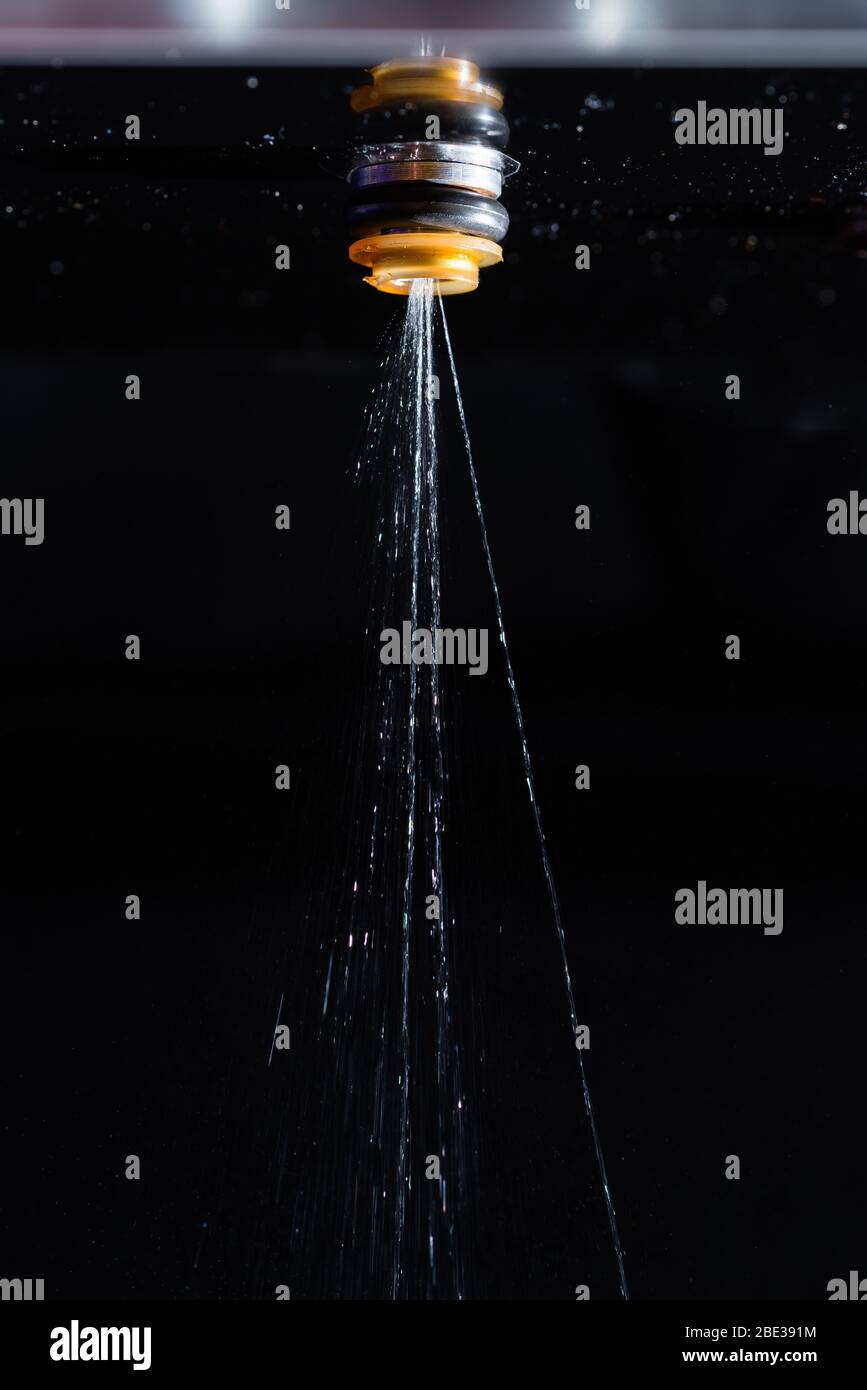 Faulty Fuel Injector valve against black background Stock Photo Alamy