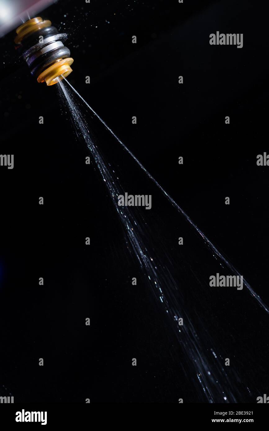 Faulty Fuel Injector valve against black background Stock Photo Alamy