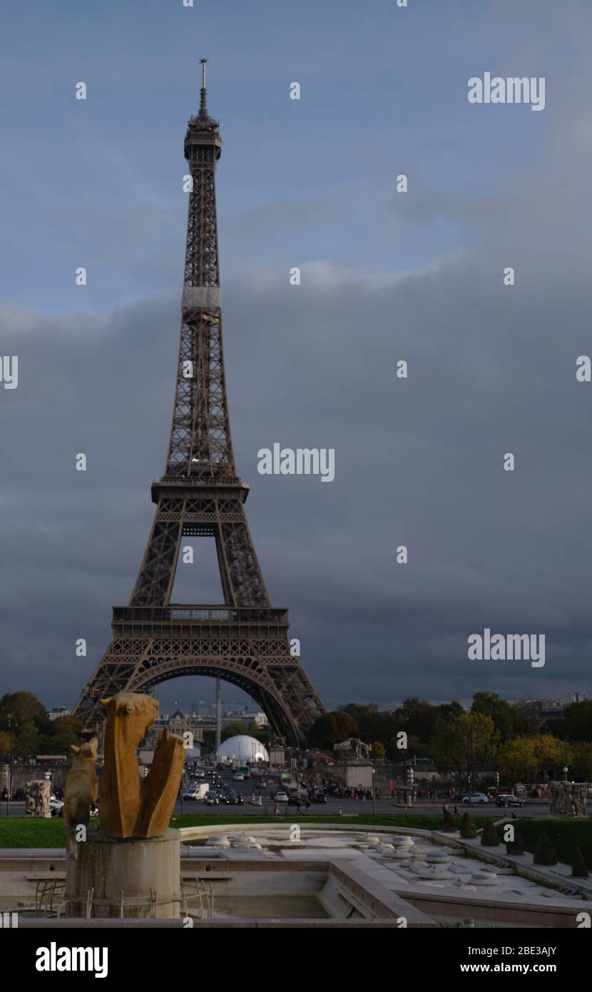 Eiffel Tower Behind Bronze Sculpture Stock Photo