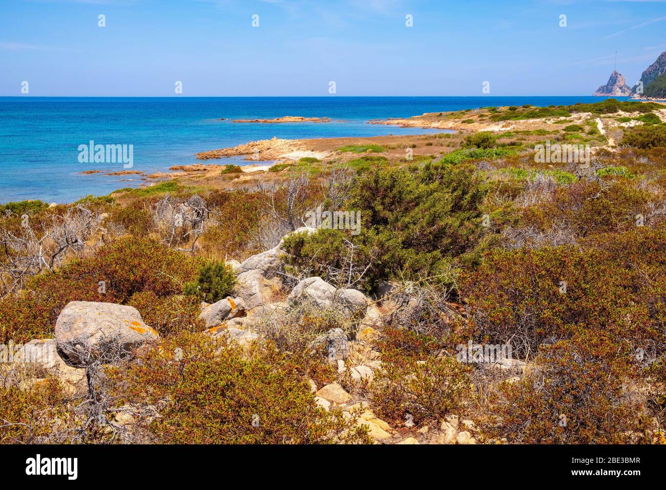 Panoramic view of Spalmatore di Terra peninsula of Marine Protected Area reserve with Mediterranean scrub of Isola Tavolara island on Tyrrhenian sea Stock Photo