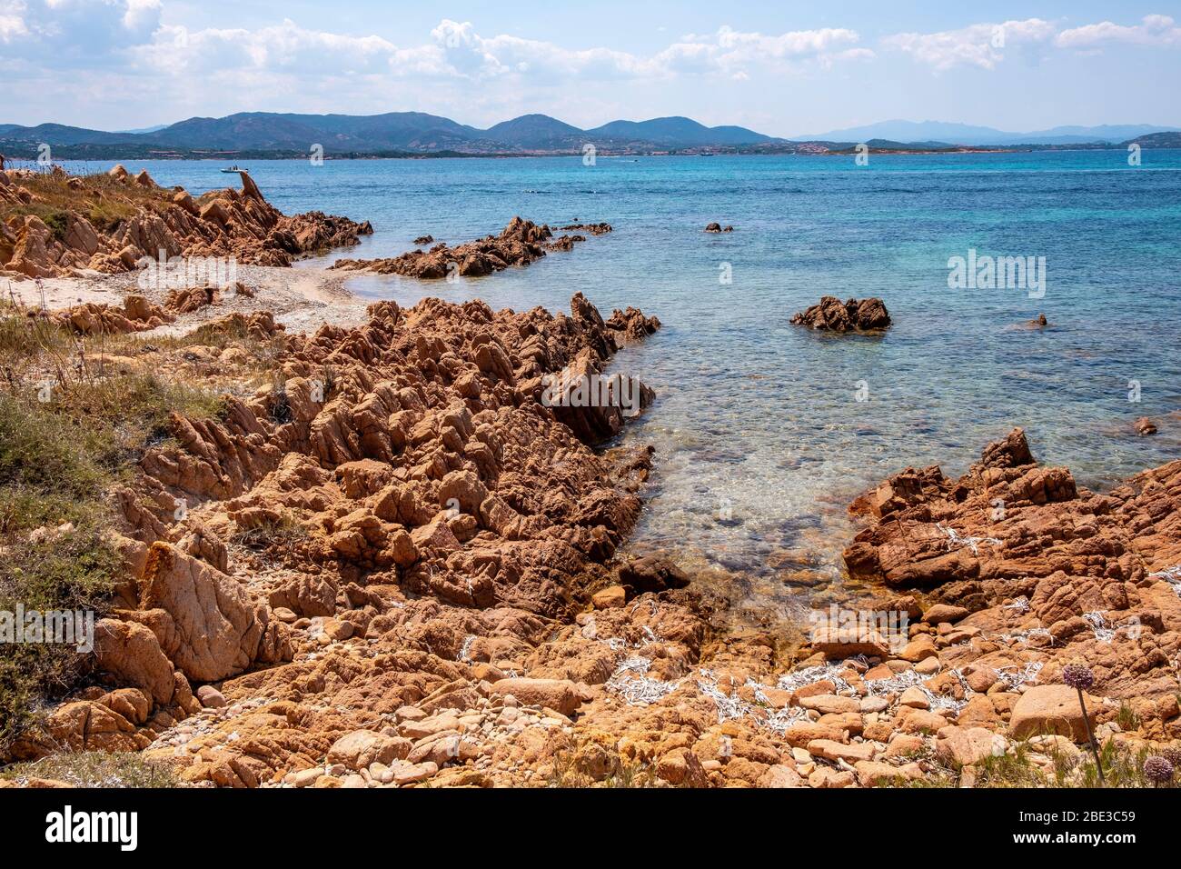 Panoramic view of Spalmatore di Terra peninsula of Marine Protected Area reserve with seashore rocks of Isola Tavolara island on Tyrrhenian Sea Stock Photo