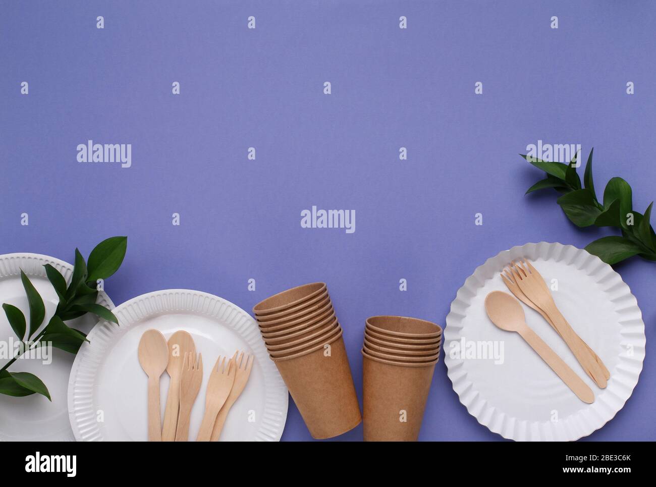 Paper cups and plates, and wooden cutlery Stock Photo Alamy