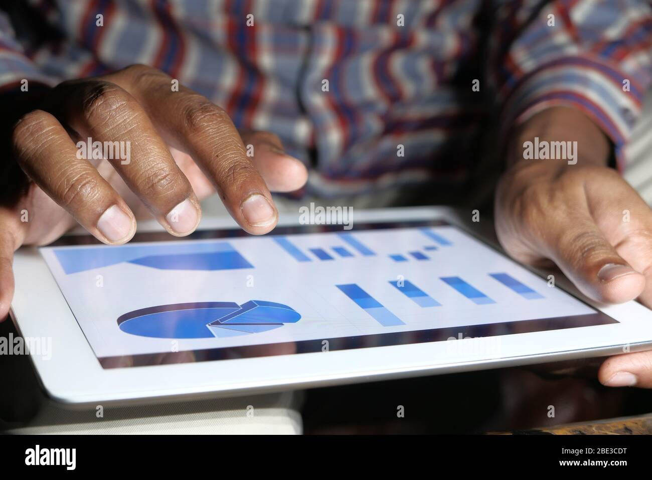 businessman analyzing financial data on digital tablet  Stock Photo
