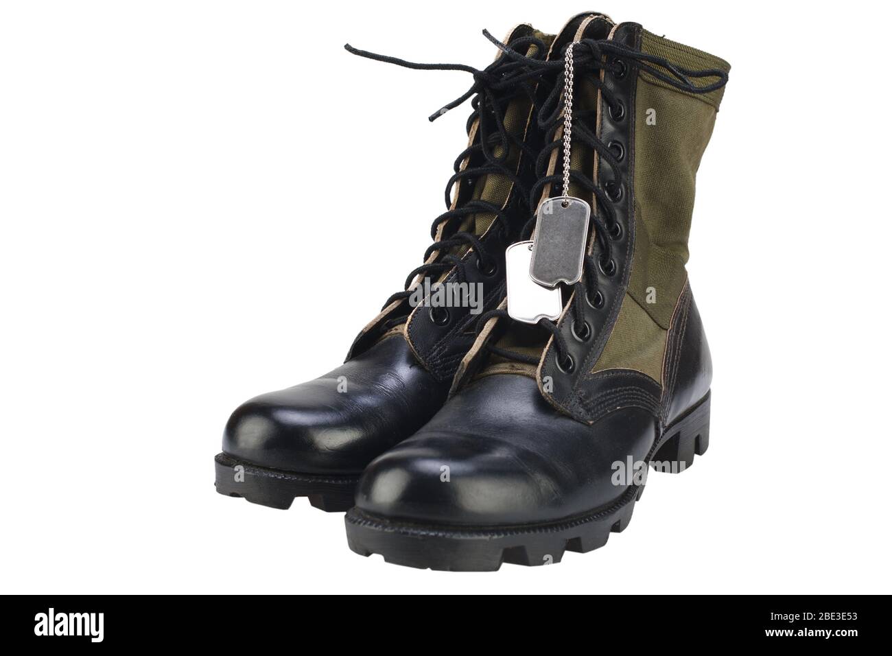 New brand US army pattern jungle boots with dog tags isolated on white background Stock Photo
