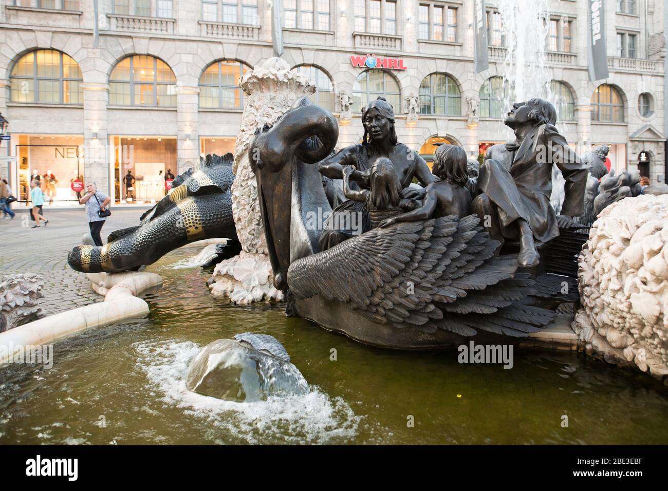 The Hans Sachs-Brunnen Ehekarussell fountain with its controversial sculptures about married life, on the Ludwigsplatz in Nuremberg, Germany. Stock Photo