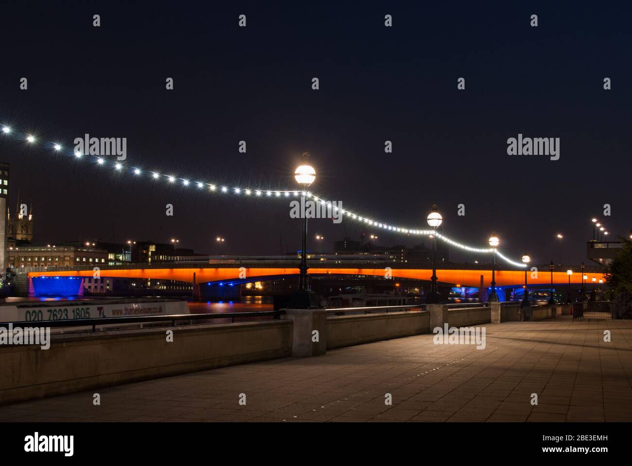Blue Orange Illuminated Lights London Bridge, Southwark, London, SE1 by Mott, Hay and Anderson with Lord Holford Concrete Structure Span Stock Photo