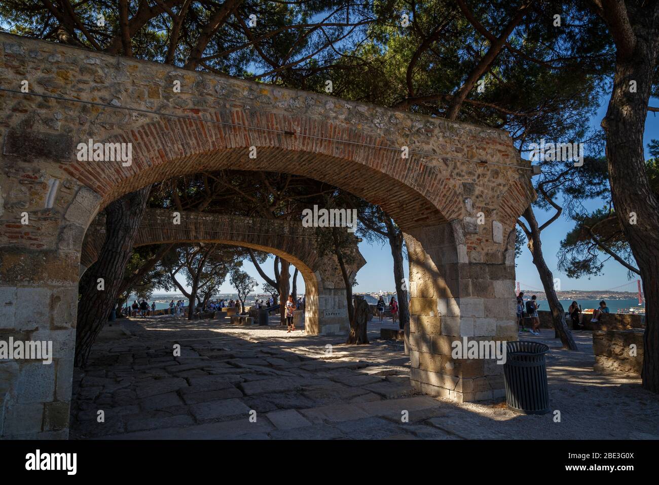 Arches and many people at the observation terrace next to the historic Sao Jorge Castle in Lisbon, Portugal. Stock Photo