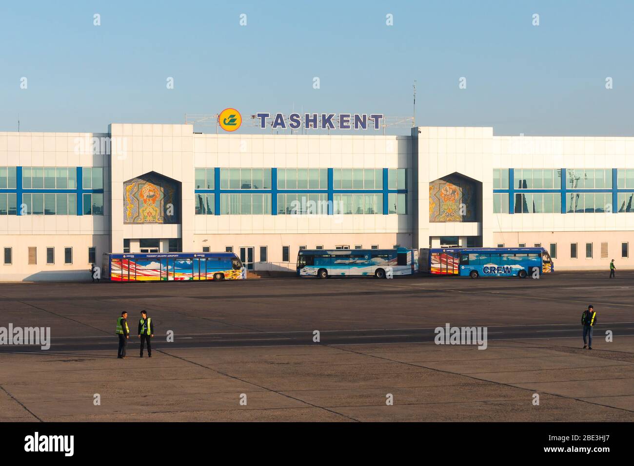 Islam Karimov Tashkent International Airport passengers terminal in Uzbekistan. Facade showing the city name and Uzbekistan Airways logo. Stock Photo