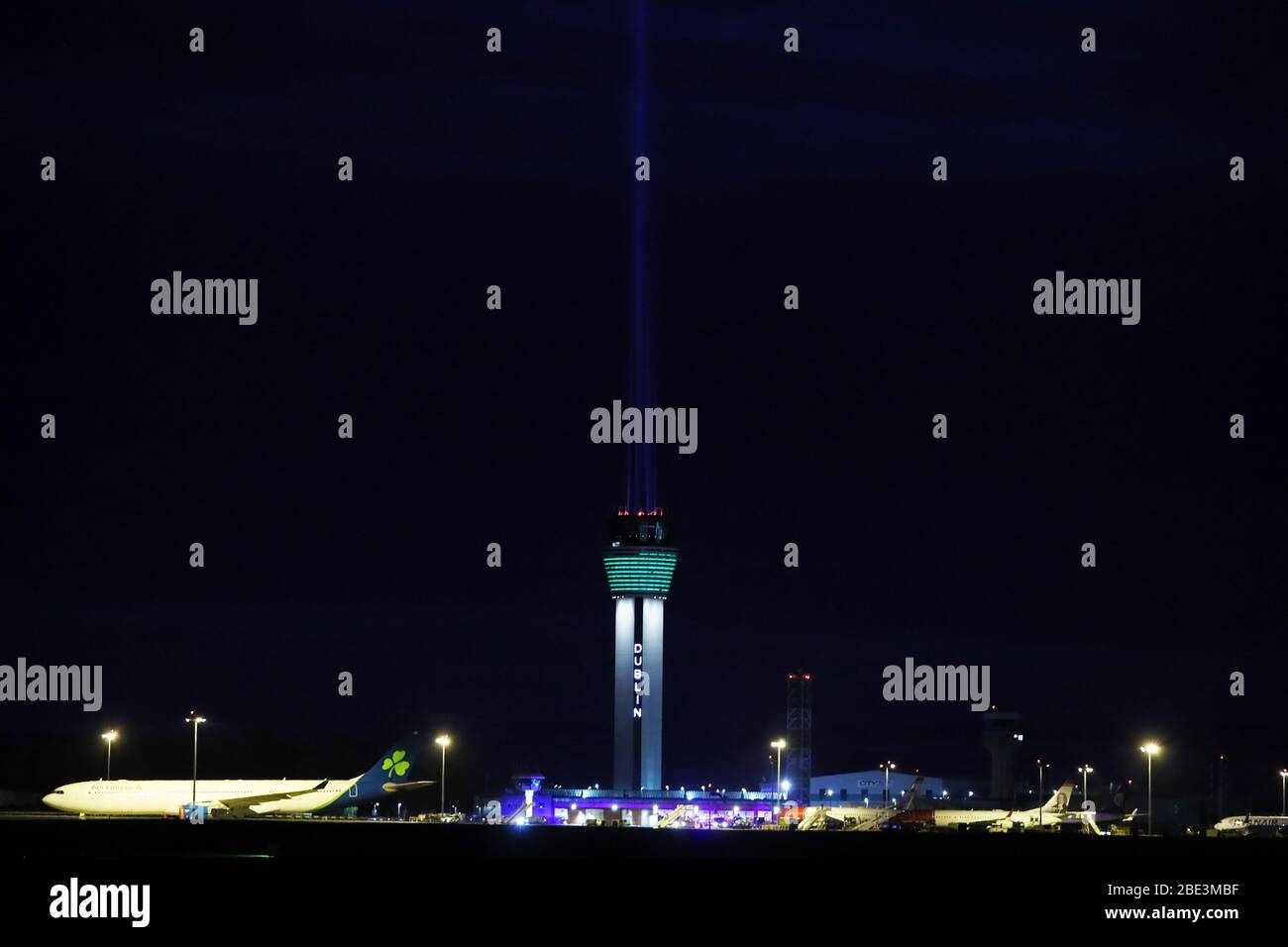A large beam of light shines out of the new air traffic control tower at Dublin airport as part of the Shine Your Light campaign in tribute to front line health workers and those affected by the coronavirus outbreak. Stock Photo