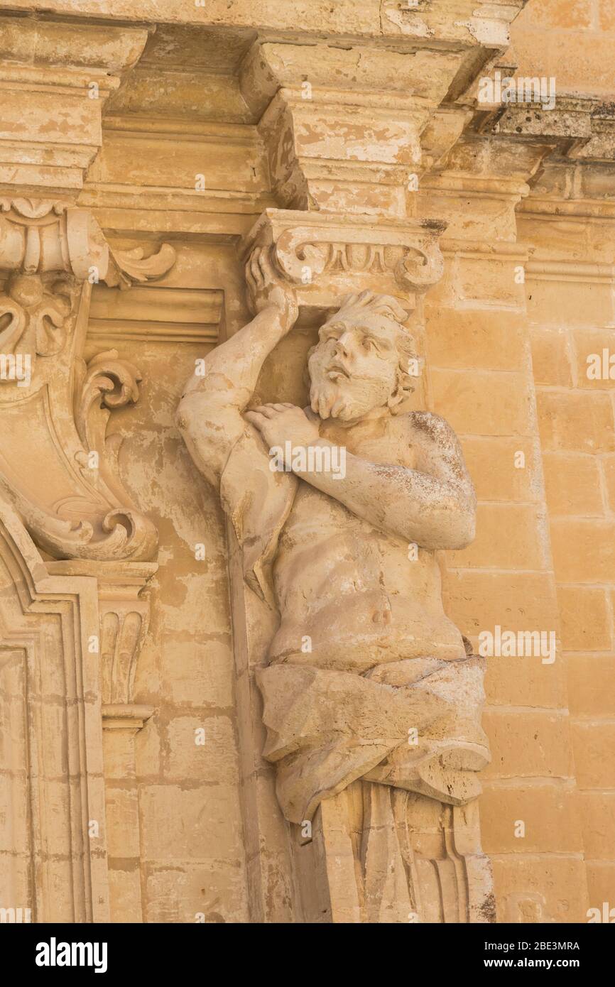 Sculpted figure set into the doorway at the Cathedral Museum, Silent City of Mdina, Malta Stock Photo