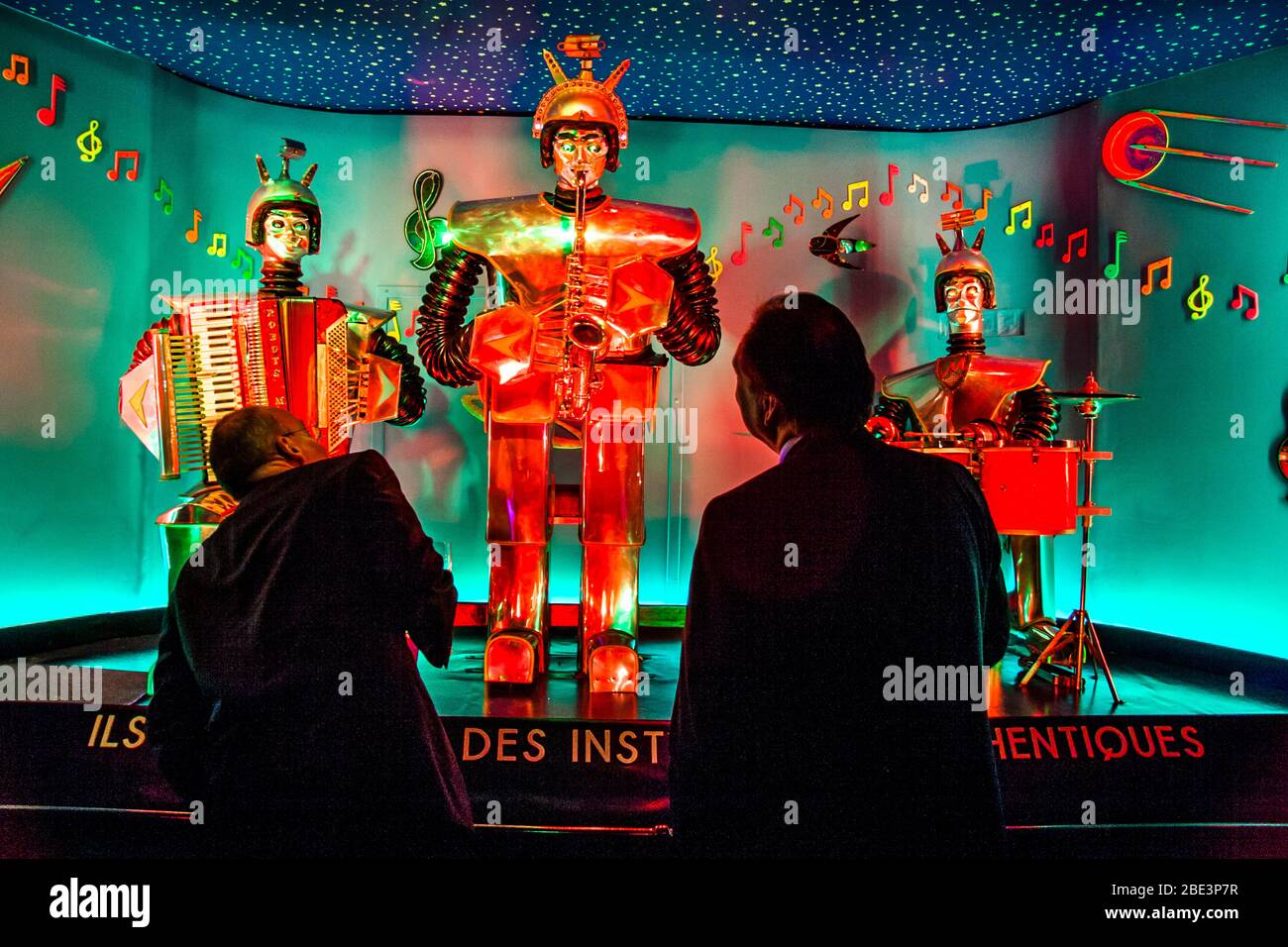 The real people are amazed: Robots Music is an art installation with real instruments Stock Photo