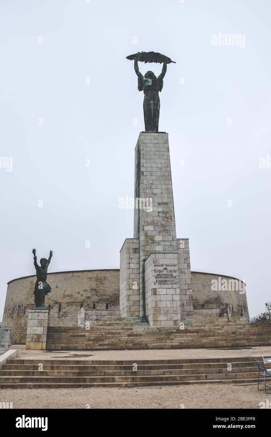 Budapest, Hungary - Nov 6, 2019: Liberty Statue on the top of the Gellert Hill in the Hungarian capital. In remembrance of the Soviet liberation of Hungary during World War II. Vertical photo. Stock Photo