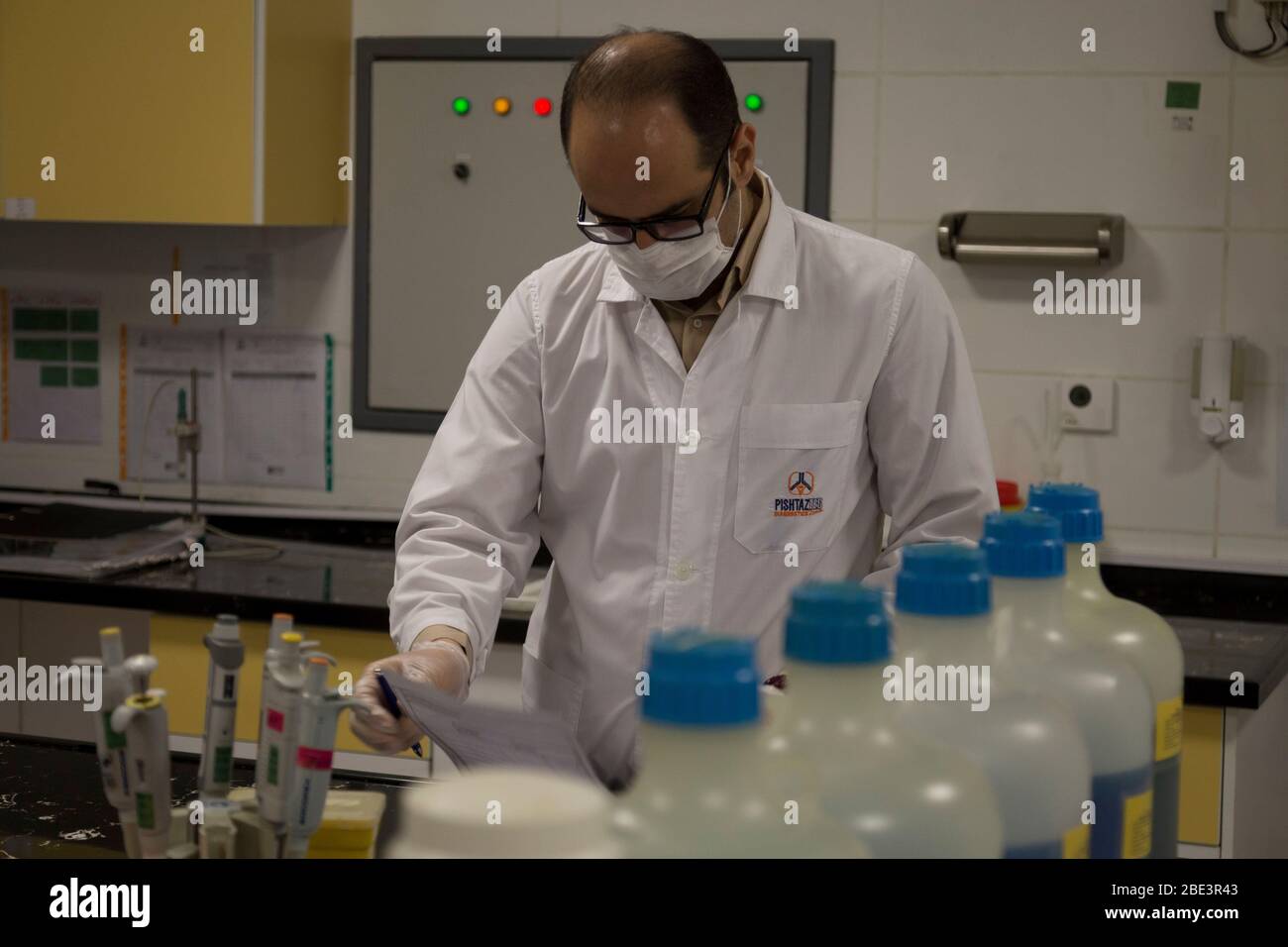 Karaj, Alborz, Iran. 11th Apr, 2020. Iranian medical staff work on the production of COVID-19 test kits at the Pishtaz-Teb knowledge-based medical company just outside the city of Karaj, in the northern Alborz Province. Iran launched the production line of serology-based test kits that can discover whether a person has ever been exposed to the novel coronavirus or suffered from the COVID-19 disease and recovered or not. Iran is one of the most affected by pandemic COVID-19 disease caused by the SARS-CoV-2 coronavirus. Credit: Rouzbeh Fouladi/ZUMA Wire/Alamy Live News Stock Photo