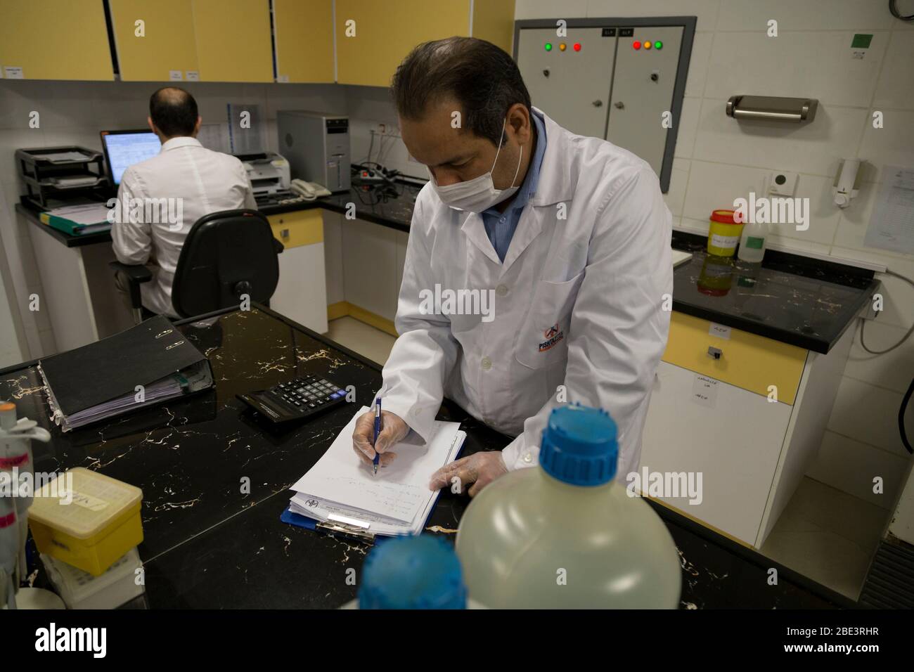 Karaj, Alborz, Iran. 11th Apr, 2020. Iranian medical staff work on the production of COVID-19 test kits at the Pishtaz-Teb knowledge-based medical company just outside the city of Karaj, in the northern Alborz Province. Iran launched the production line of serology-based test kits that can discover whether a person has ever been exposed to the novel coronavirus or suffered from the COVID-19 disease and recovered or not. Iran is one of the most affected by pandemic COVID-19 disease caused by the SARS-CoV-2 coronavirus. Credit: Rouzbeh Fouladi/ZUMA Wire/Alamy Live News Stock Photo