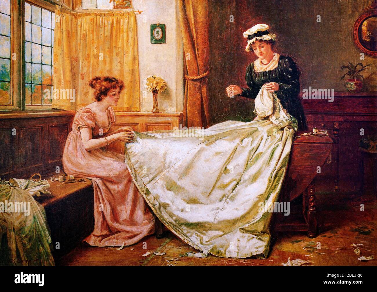 George Goodwin Kilburne (1839-1924) was an English genre painter specialising in accurately drawn interiors with figures. His  paintings often portrayed the upper classes and ultra-fashionable female beauties in opulent late 18th and early 19th-century settings. His depiction of this beauty was heightened by his attention to detail with dress, and richly decorated interiors. In this painting a woman and maid are putting the finishing touches to a wedding dress. Stock Photo