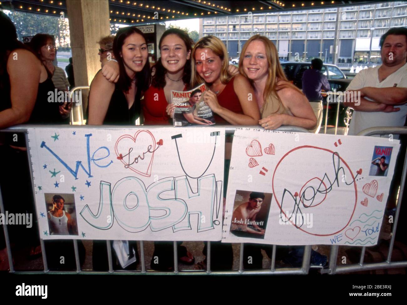 Teen age fans of actor Josh Hartnett with home made signs and a copy of Vanity Fair magazine with Josh on the cover at the premiere of the movie adaption of Hamlet in Century City, Los Angeles, CA Stock Photo