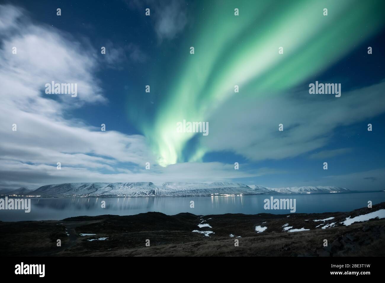 Northern lights aurora borealis over Akureyri city in Iceland Stock Photo