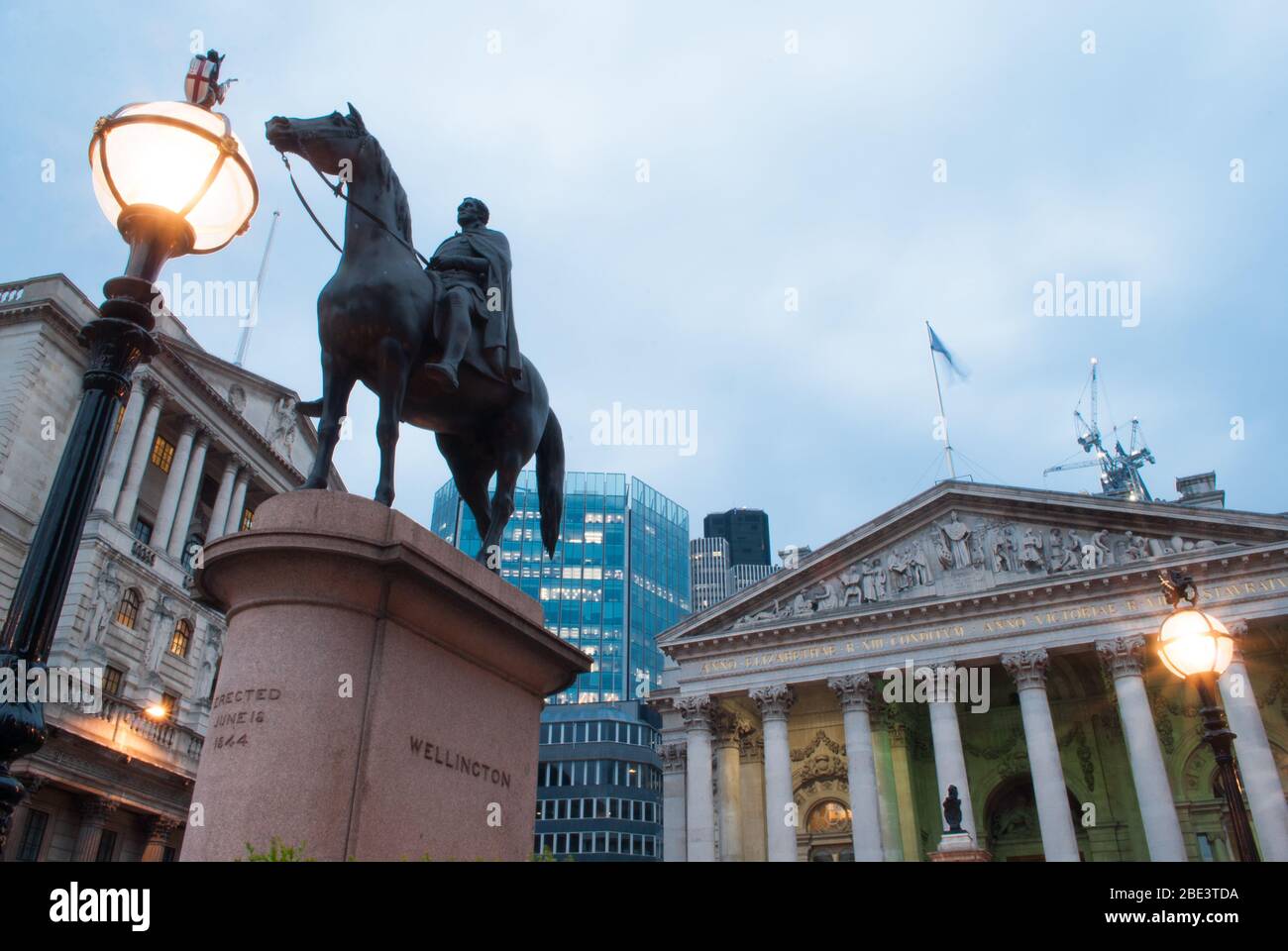 Dusk Evening Illuminated Lights Frieze Pediment Corinthian Column at Royal Exchange, Threadneedle Street, City of London, EC3V 3LR by Sir William Tite Stock Photo