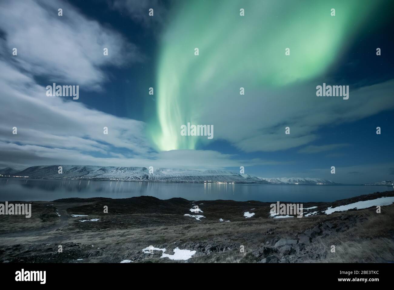 Northern lights aurora borealis over Akureyri city in Iceland Stock Photo