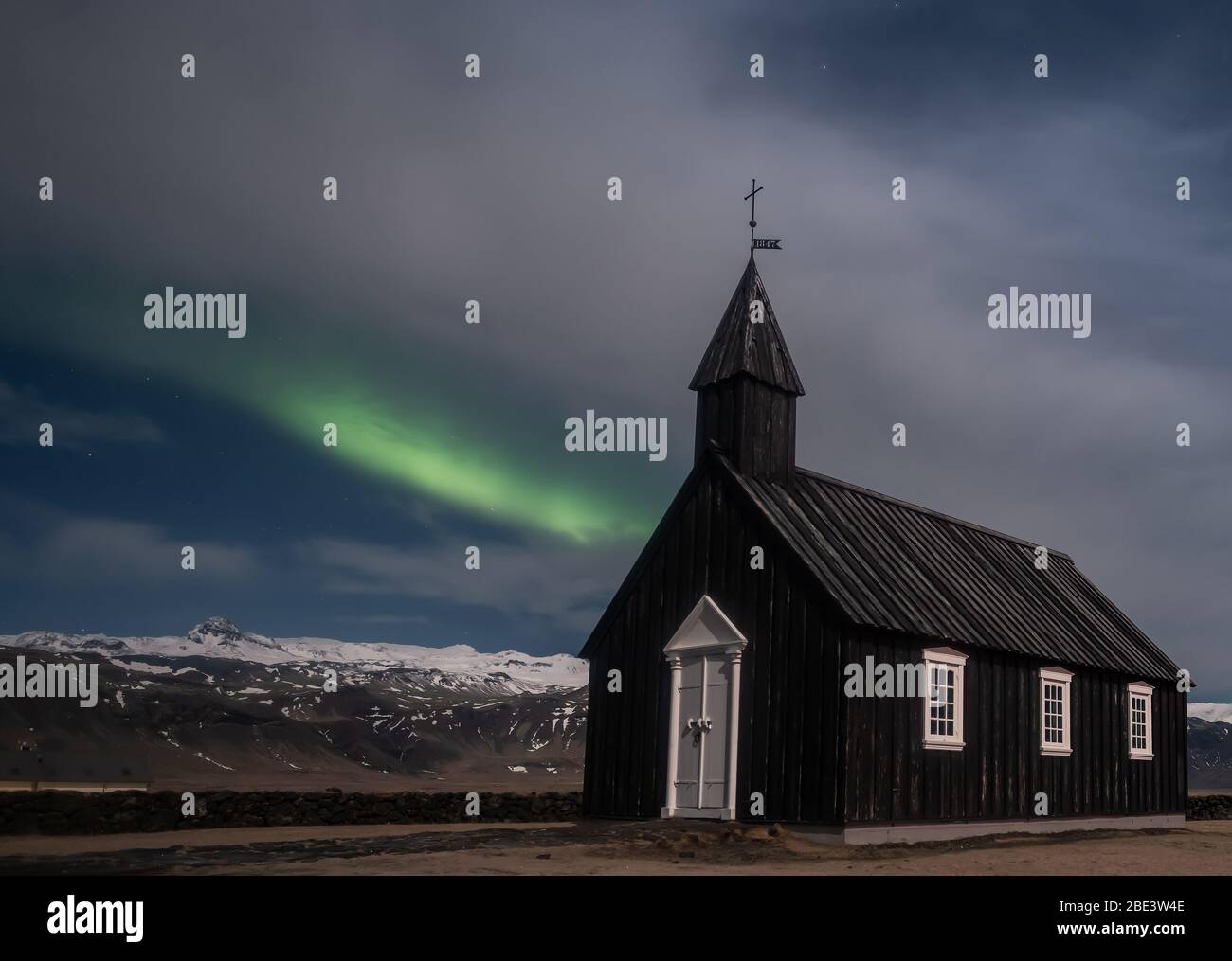 Northern lights aurora borealis over Black church in Iceland Stock Photo