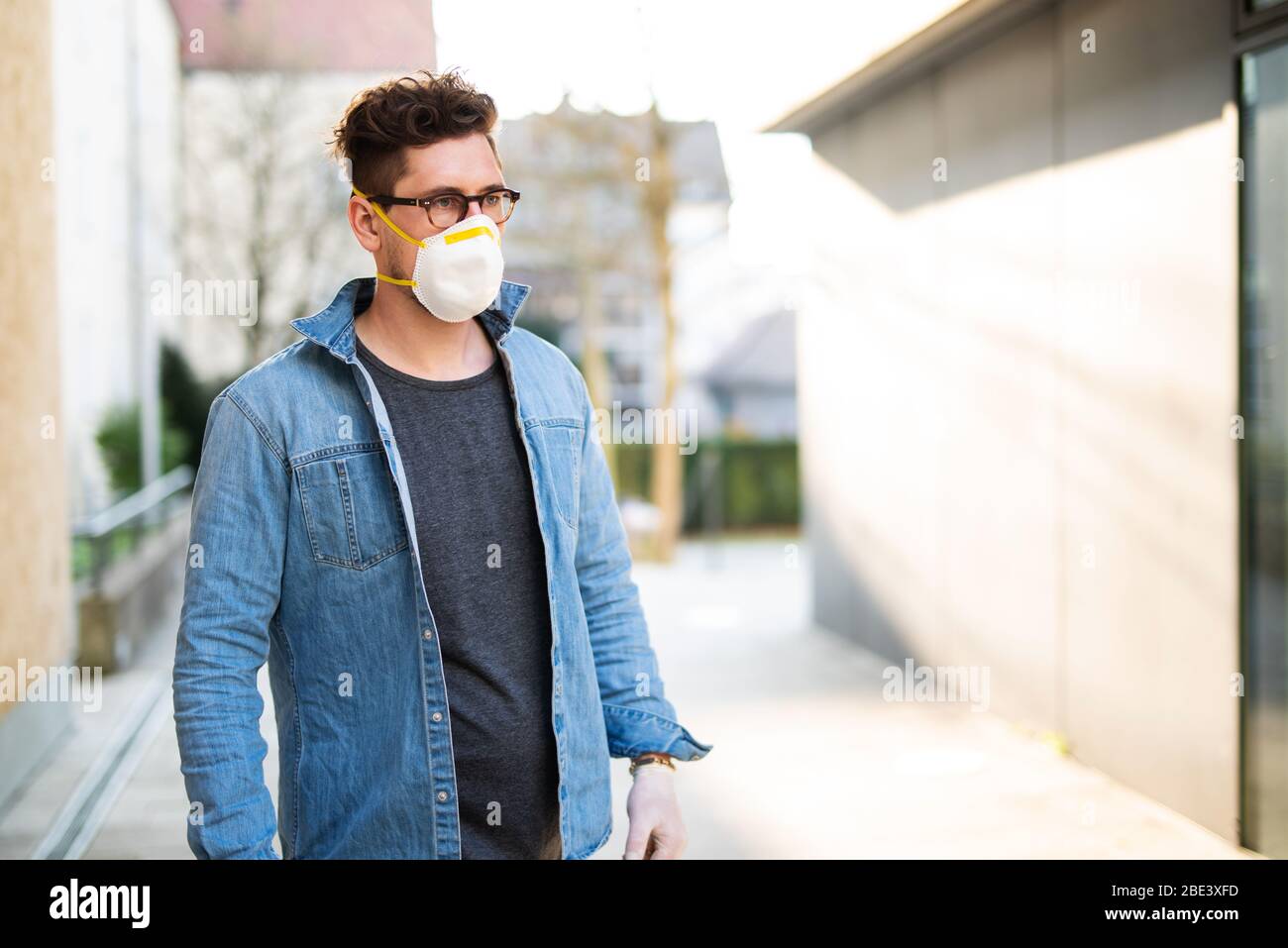 Portrait of a young man with breathing mask outdoors Stock Photo