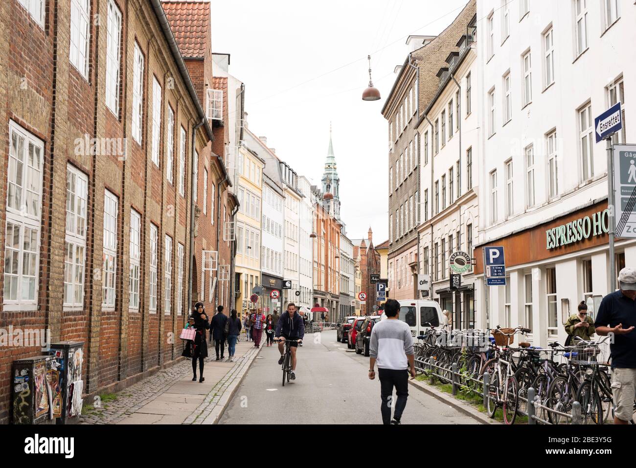 Shops and restaurants line the Krystalgade, a busy street in Copenhagen, Denmark. Stock Photo