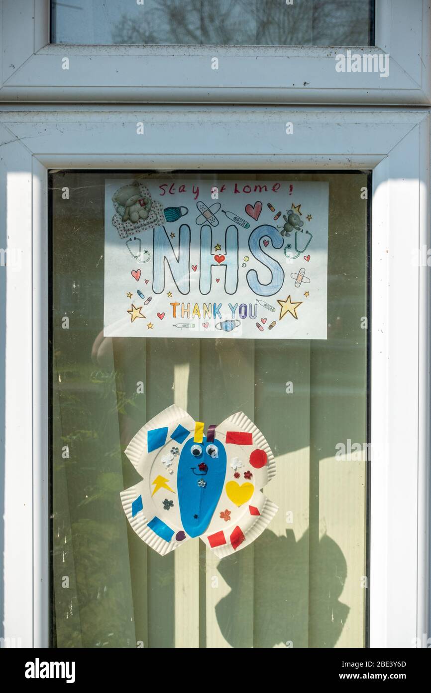 A child's artwork displayed in a front window of a house to show appreciation to the NHS and cheer up passers by during the coronavirus pandemic. Stock Photo