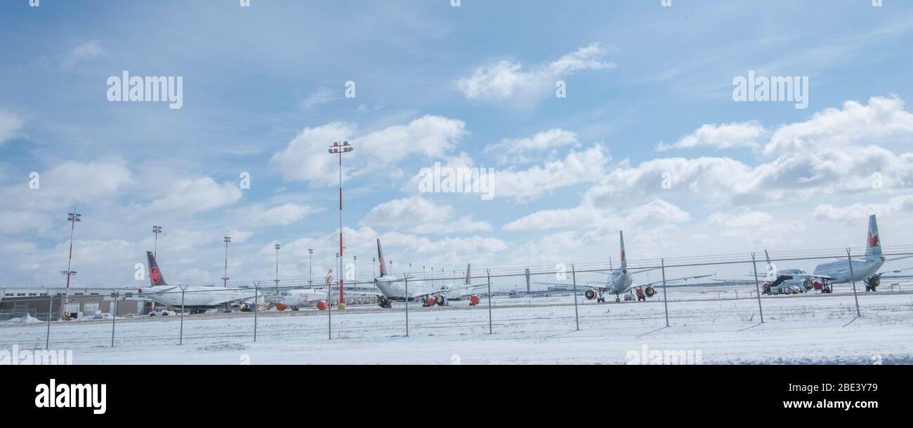 April 11 2020 - Calgary , Alberta, Canada - Airliners parked at the Calgary International Airport - Covid-19 Pandemic Stock Photo