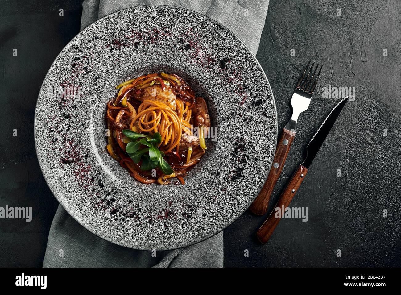 Spaghetti with vegetables tomato sauce and meat. Traditional italian