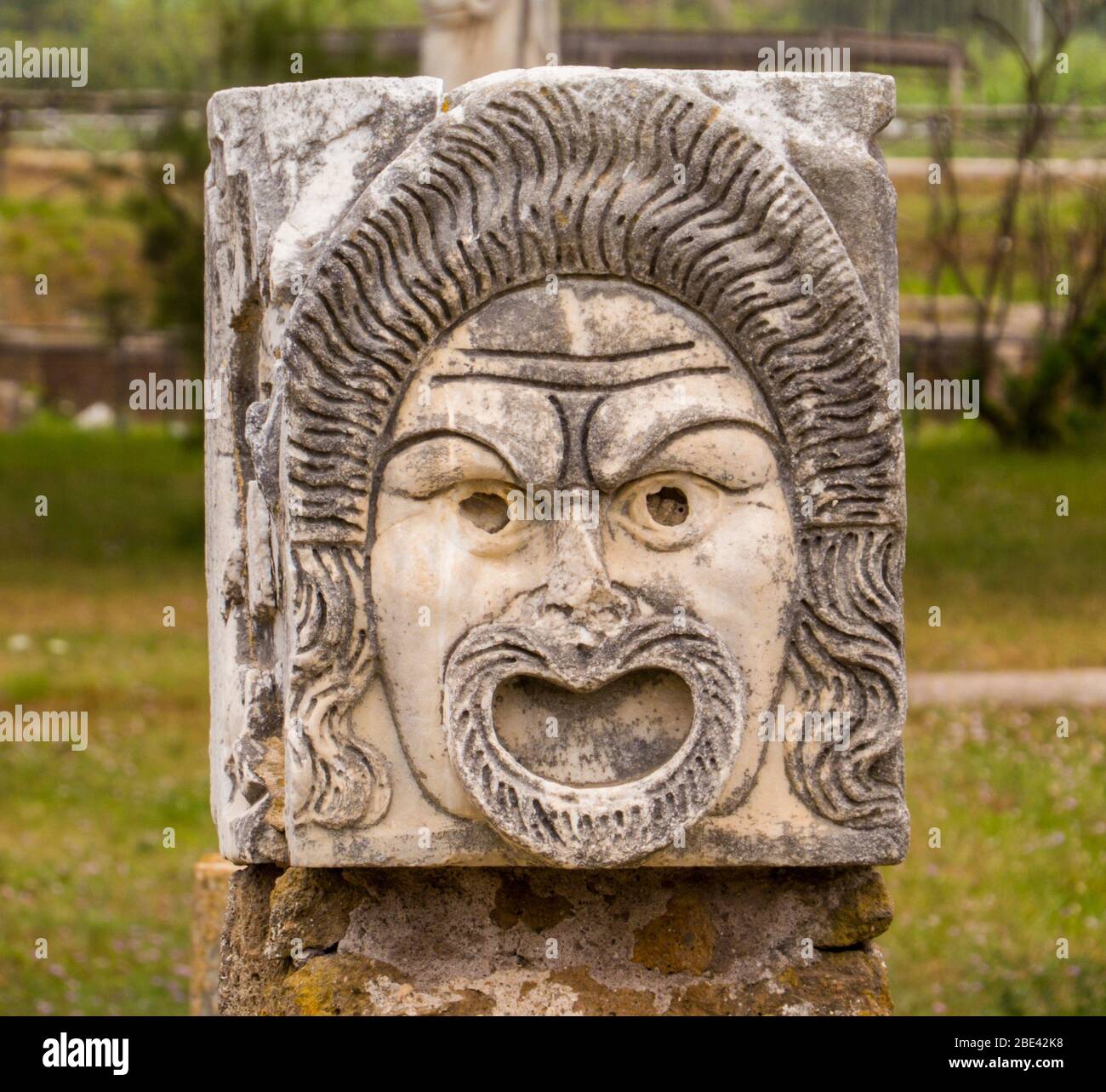 Mask detail, Roman Theater, Ancient Archaeological Site of Ostia Antica in Rome, Italy Stock Photo