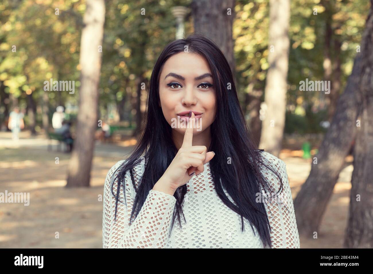 Portrait of happy Indian young woman smiling, looking at camera with ...