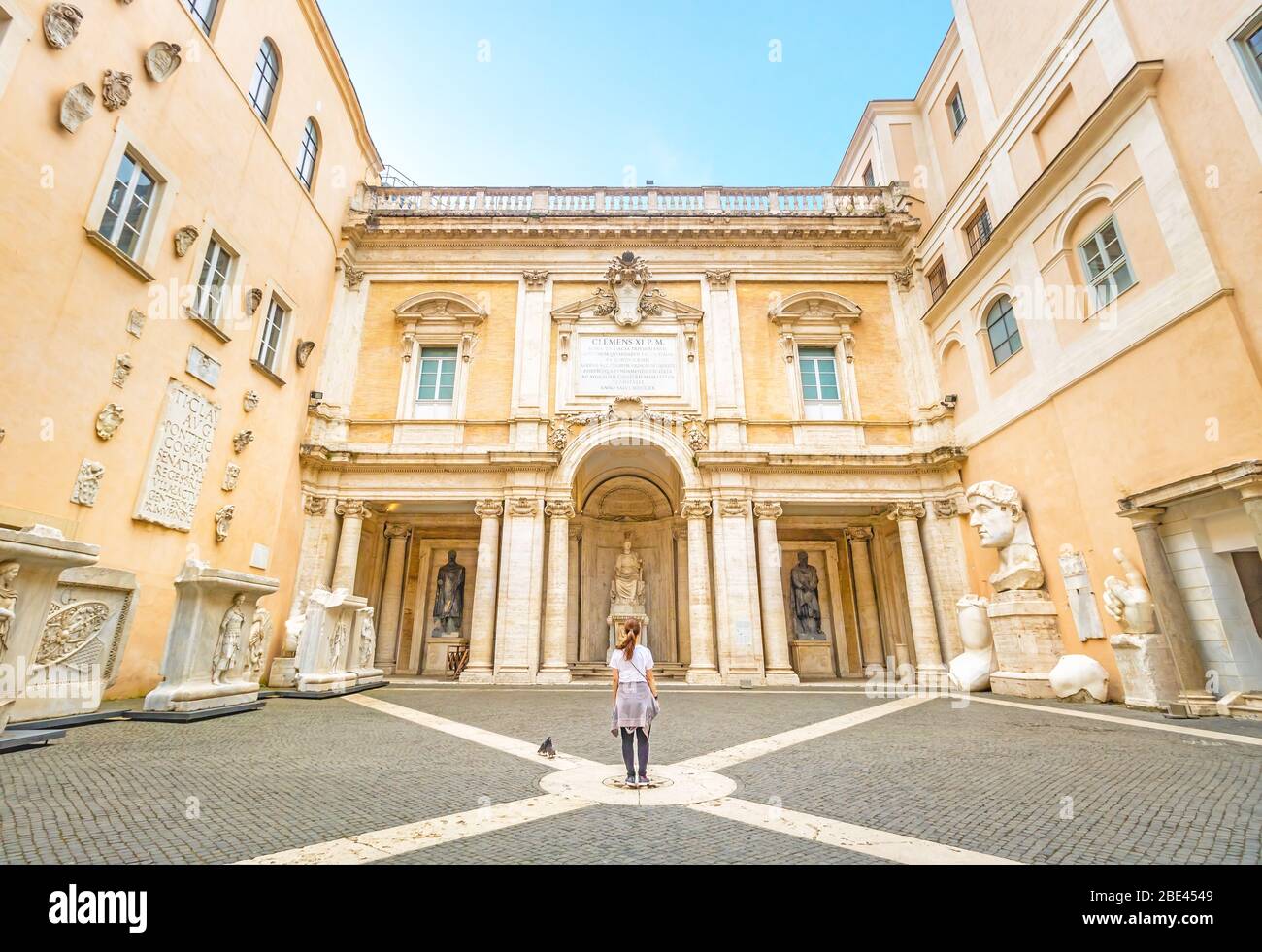 Girl Standing Alone in the Courtyard of Capitoline Museum in Capitoline Hill, Rome, Italy Stock Photo