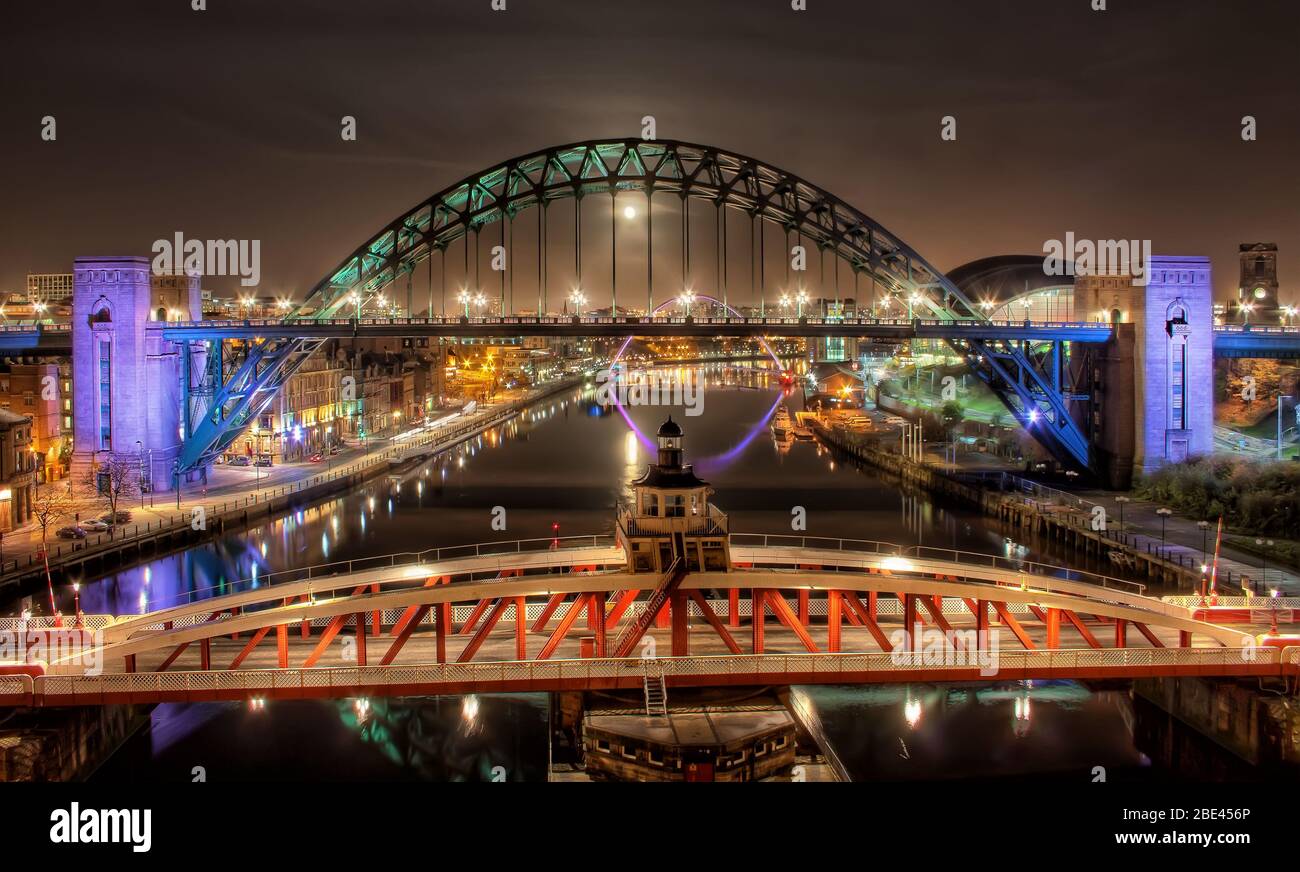 Panoramic View of the Iconic Tyne Bridge and River Tyne under Moonlight and Clear Night Sky, Newcastle UK Stock Photo