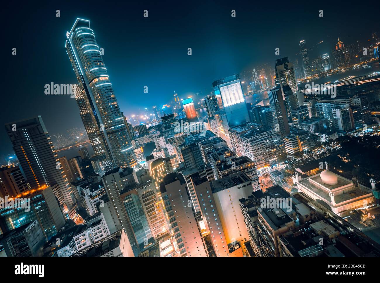 Panoramic View of Rooftops of Futuristic Skyscrapers at Night in Vibrant Colours, Hong Kong Stock Photo