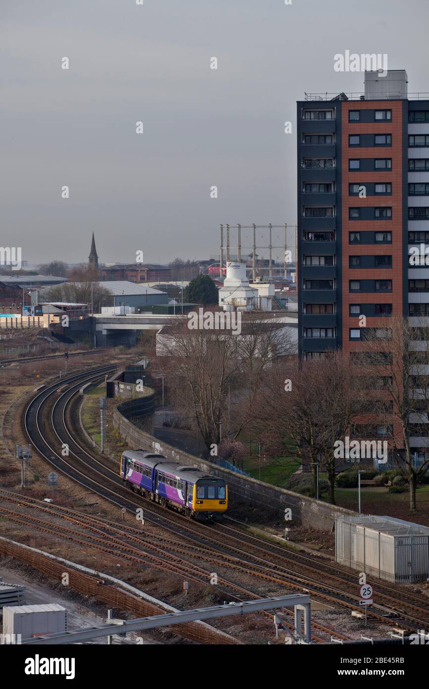Northern rail / Northern trains class 142 pacer train 142064 passing through Salford, Manchester, UK in a urban environment Stock Photo