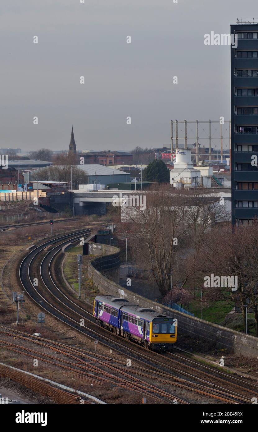 Northern rail / Northern trains class 142 pacer train 142064 passing through Salford, Manchester, UK in a urban environment Stock Photo
