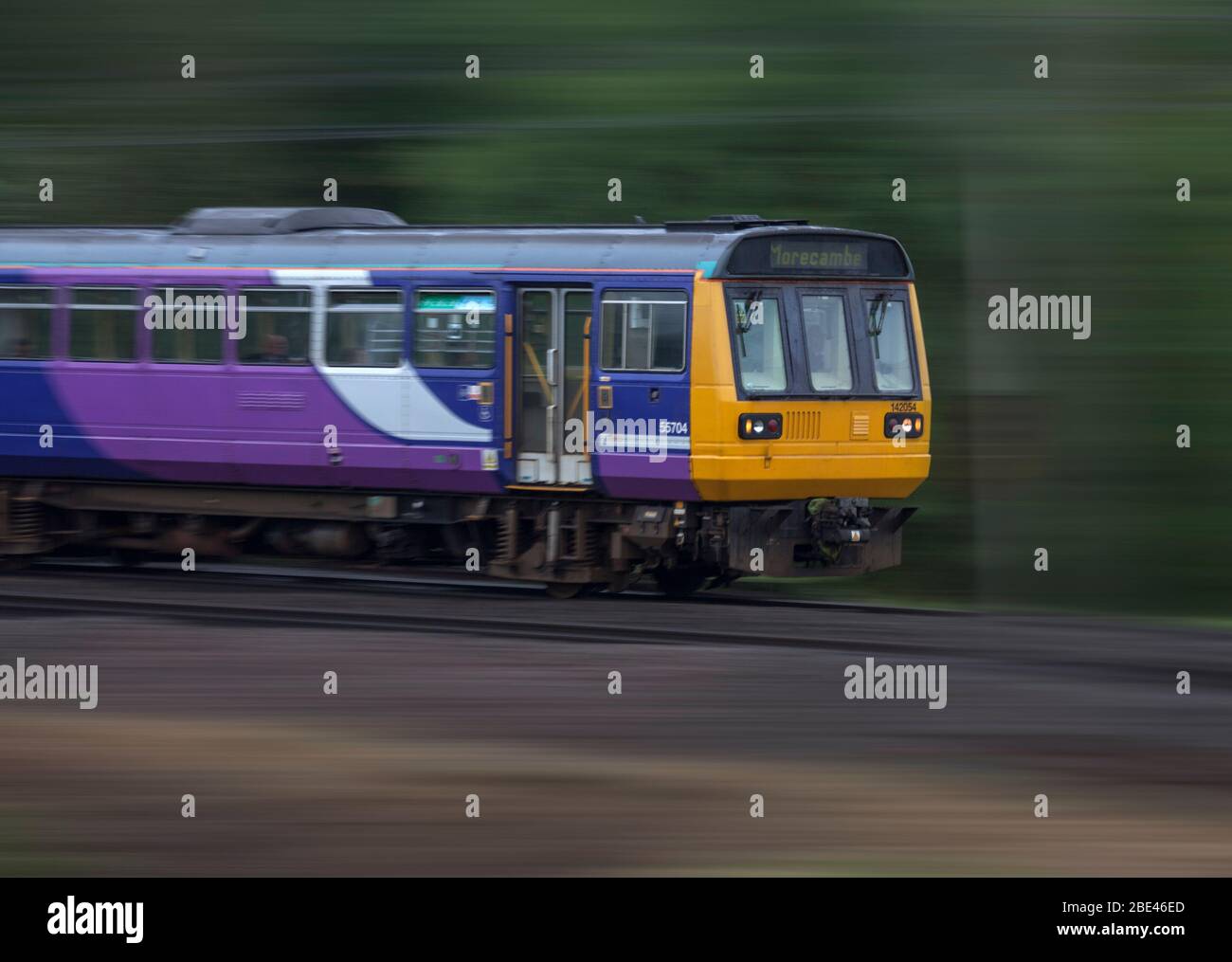 Northern Rail / Northern Trains  class 142 pacer train panned at speed on the west coast mainline Stock Photo