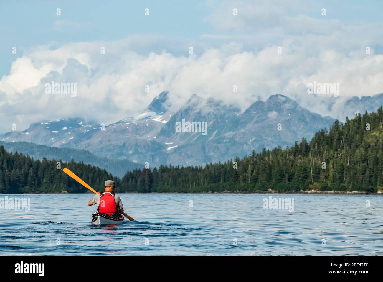 Kayaker paddling in Prince William Sound; Alaska, United States of America Stock Photo