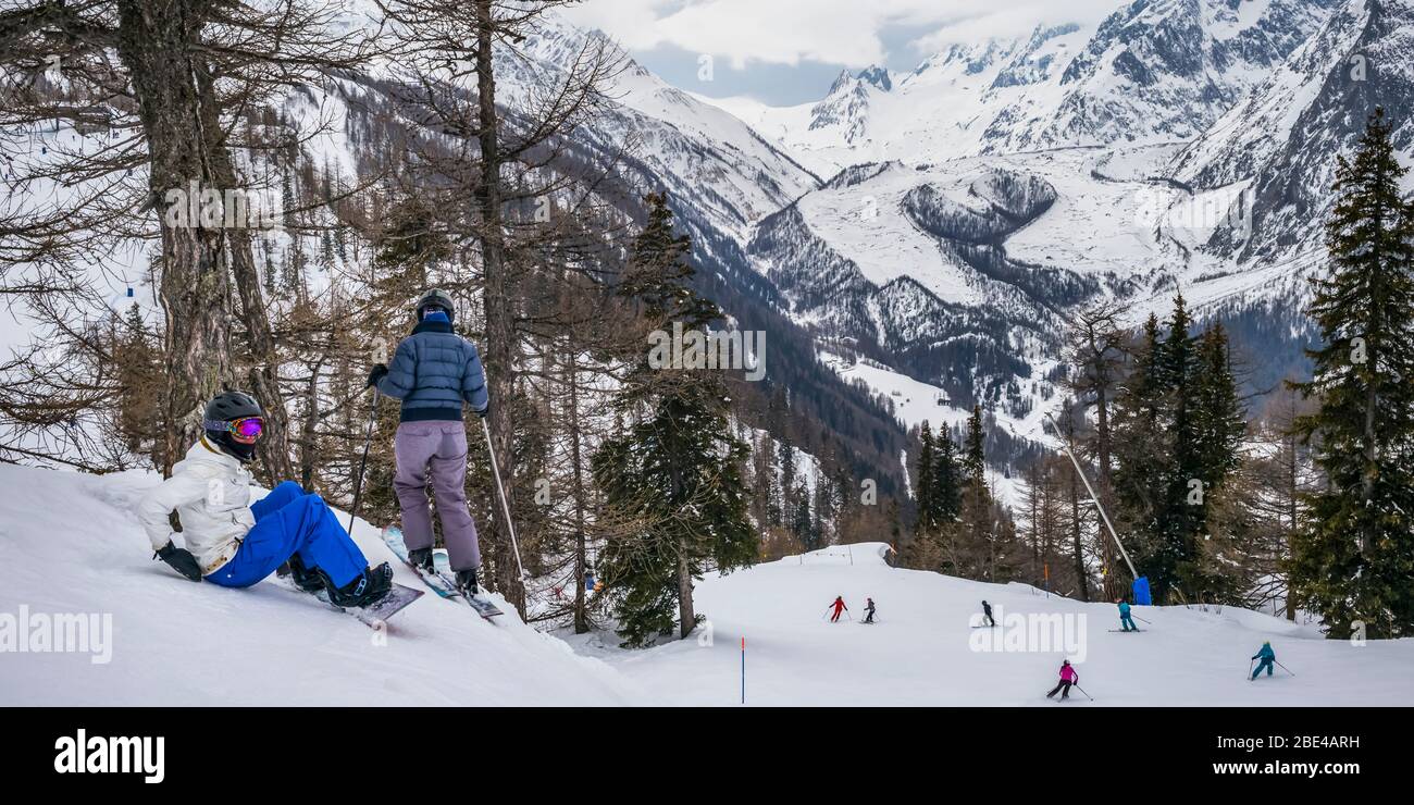 Skiers at an alpine resort, Italian side of Mont Blanc; Courmayeur, Aosta Valley, Italy Stock Photo