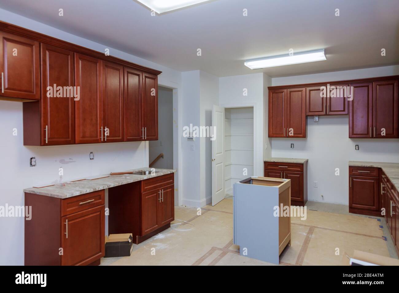 Installing Cabinets And Counter Top In A Kitchen Partially Installed Installing cabinets and counter top in a kitchen partially installed