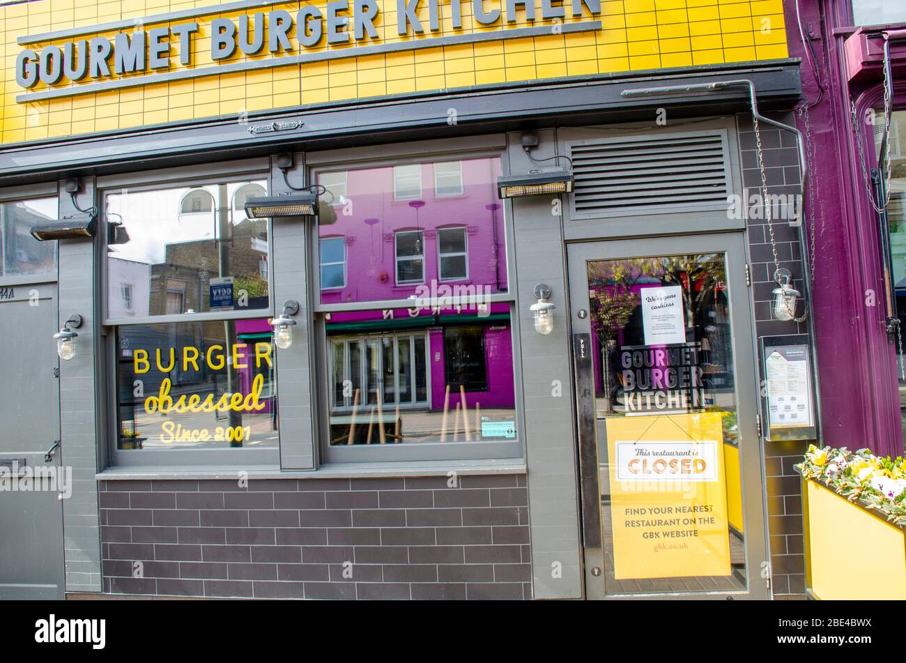 London, UK, 6 April 2020 Gourmet Burger Kitchen, 44 Northcote Rd, London SW11 1NZ. Signs in shop windows showing closed due to coronavirus. Stock Photo
