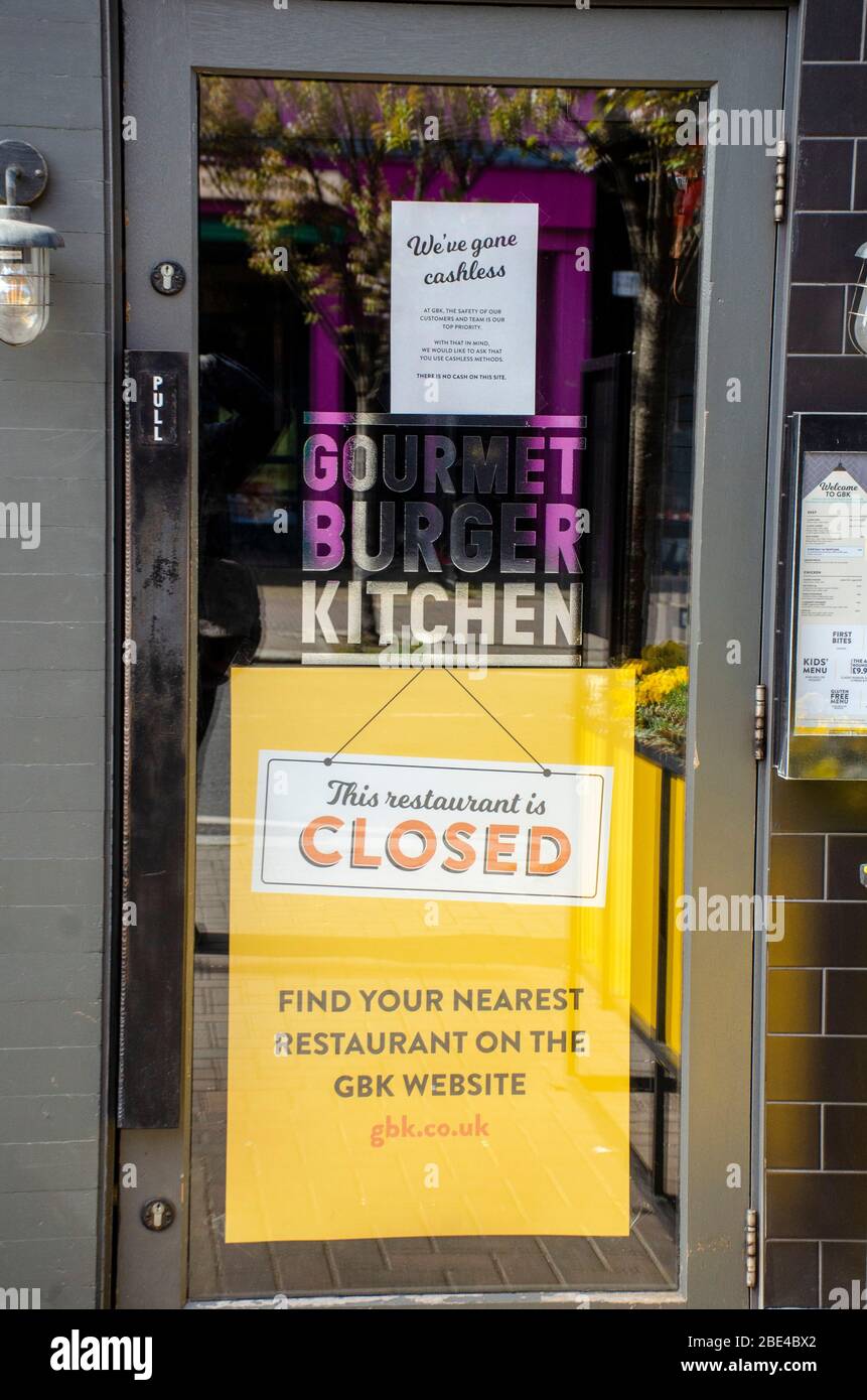 London, UK, 6 April 2020 Gourmet Burger Kitchen, 44 Northcote Rd, London SW11 1NZ. Signs in shop windows showing closed due to coronavirus. Stock Photo