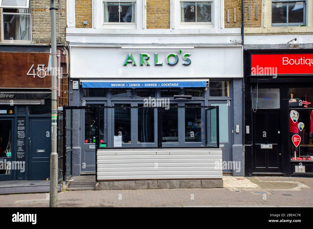London, UK, Arlo's cafe restaurant 47 Northcote Road, Battersea SW11 1NJ. Signs in shop showing closed due to coronavir Stock Photo - Alamy
